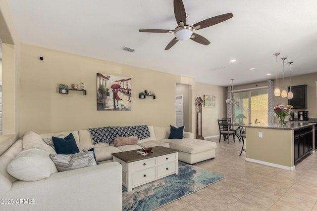 living room featuring visible vents, light tile patterned flooring, baseboards, recessed lighting, and a ceiling fan