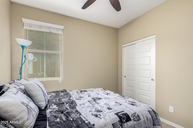 bedroom with carpet floors, a ceiling fan, and baseboards