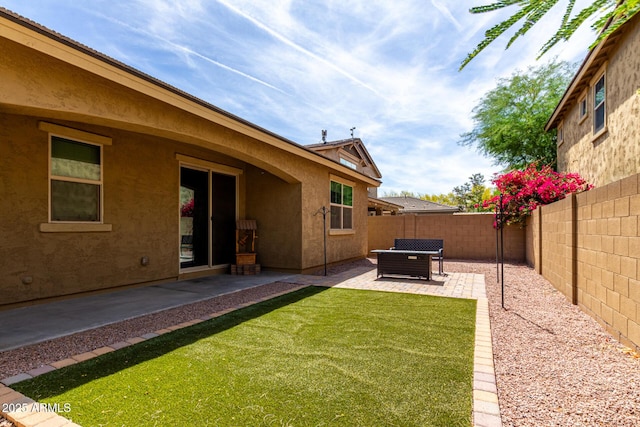 view of yard featuring a patio and a fenced backyard