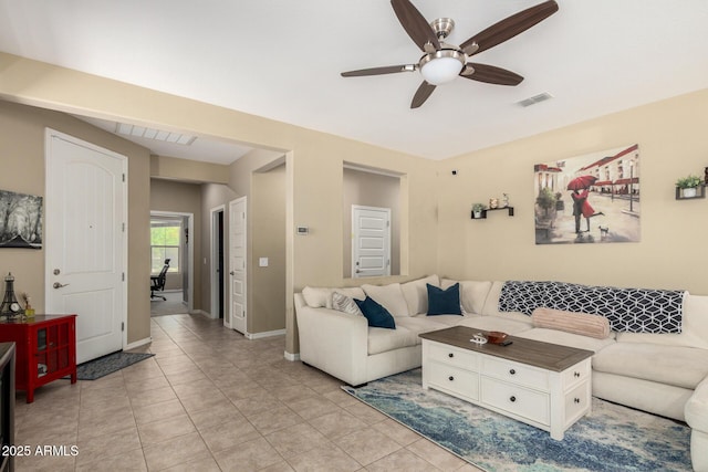 living room featuring light tile patterned floors, baseboards, a ceiling fan, and visible vents