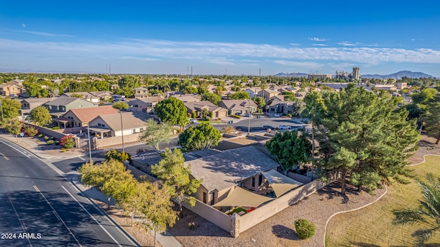 birds eye view of property with a mountain view