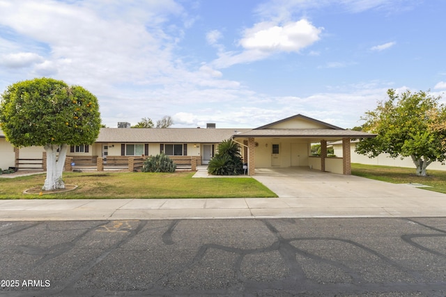 10927 W Peoria Ave, Sun City, AZ 85351 - view of front of home featuring brick siding, a front yard, concrete driveway, and a carport