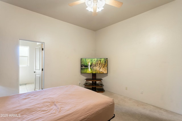 bedroom with light carpet and a ceiling fan
