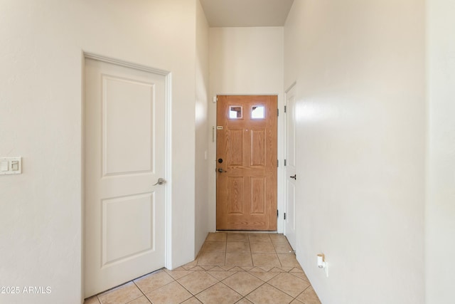 entryway with light tile patterned floors