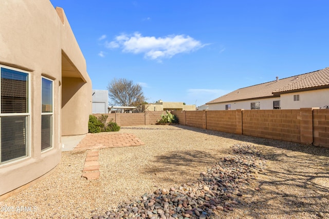 view of yard featuring a fenced backyard and a patio
