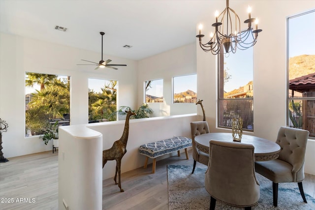 dining room featuring light hardwood / wood-style flooring and a chandelier