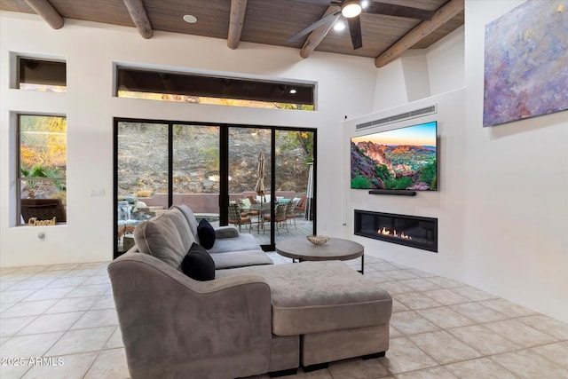 living room with ceiling fan, beam ceiling, and wooden ceiling