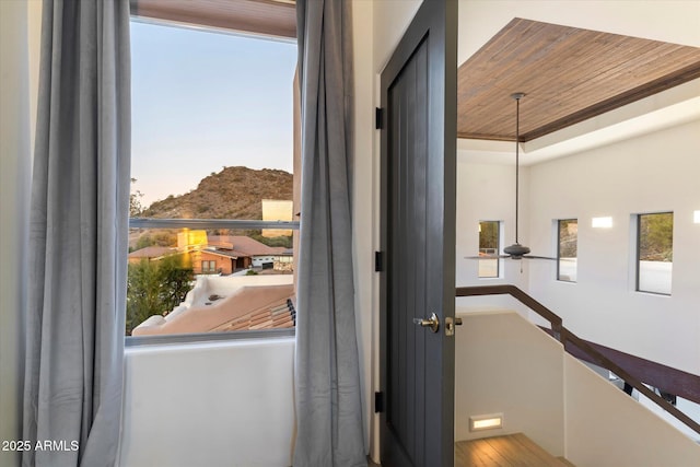 doorway with wooden ceiling