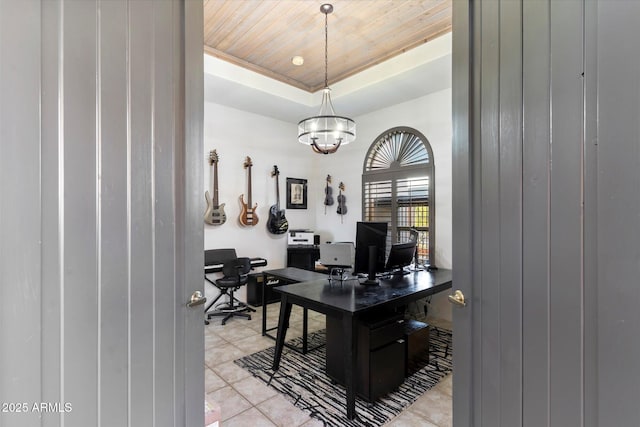 office with a raised ceiling, light tile patterned floors, wooden ceiling, and an inviting chandelier