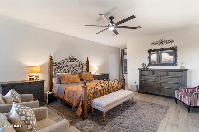 bedroom with ceiling fan and wood-type flooring