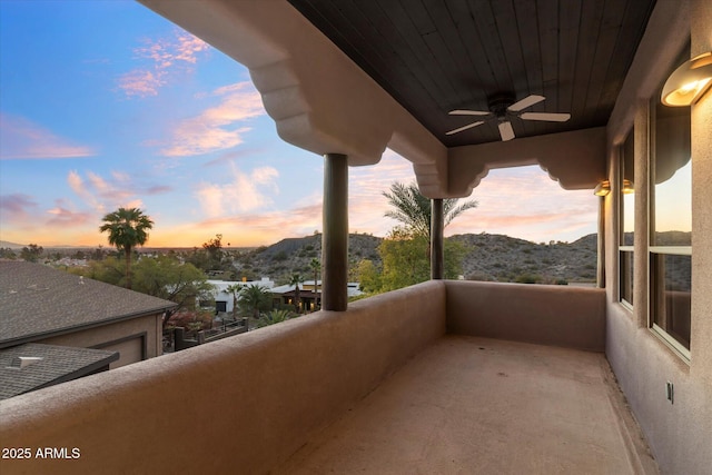 balcony at dusk with ceiling fan