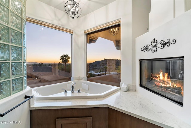 bathroom with a notable chandelier