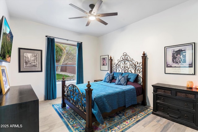 bedroom with ceiling fan and light wood-type flooring