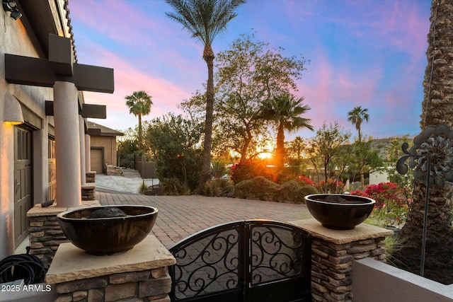 view of patio terrace at dusk