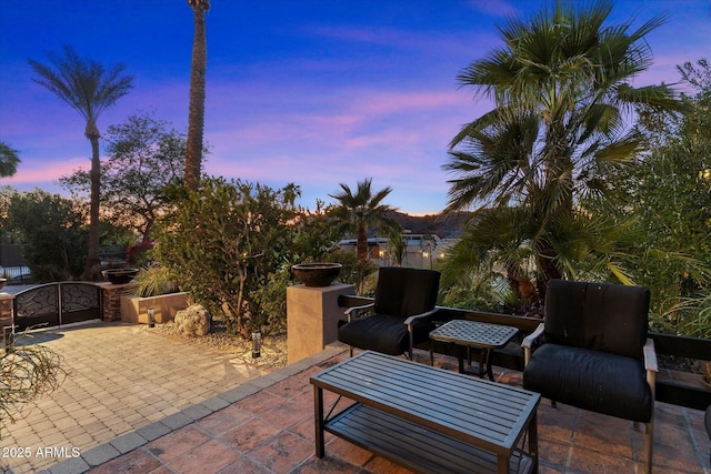 view of patio terrace at dusk