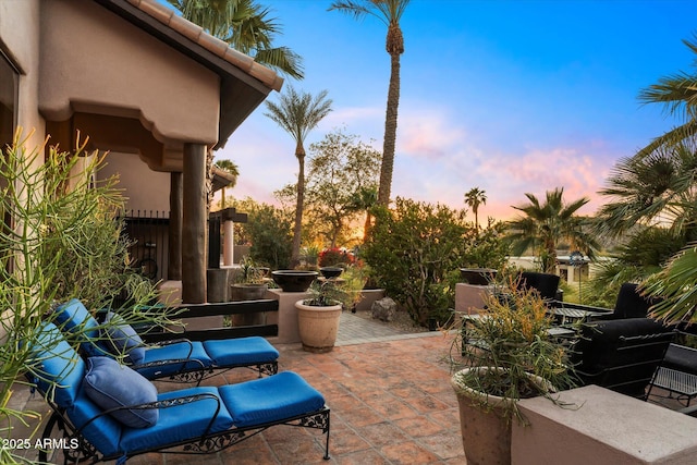 view of patio terrace at dusk