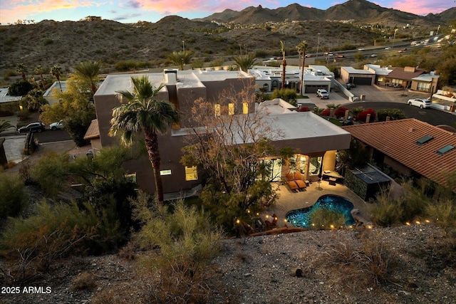 aerial view at dusk with a mountain view