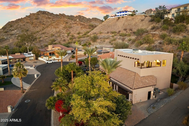 aerial view at dusk with a mountain view