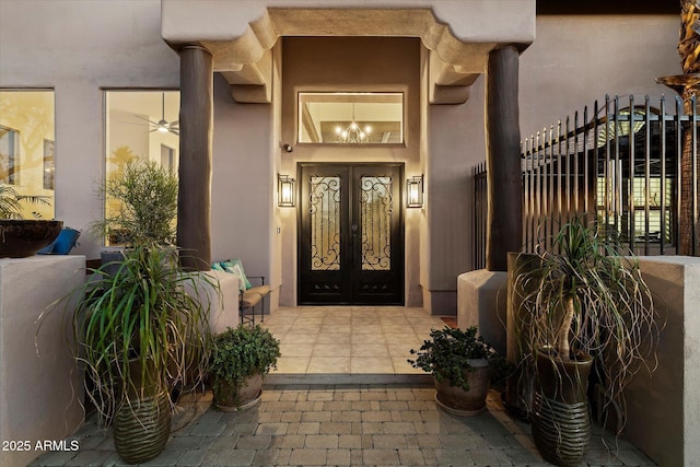 view of exterior entry featuring french doors