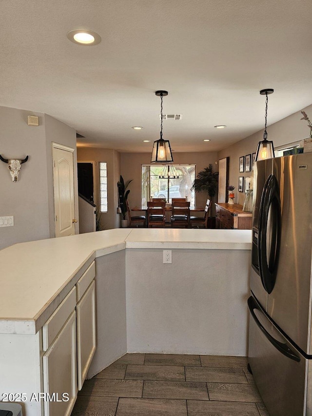 2514 W Big Oak St, Phoenix, AZ 85085 - kitchen with recessed lighting, light countertops, pendant lighting, and stainless steel fridge with ice dispenser