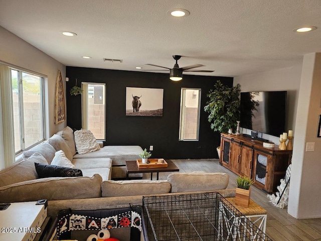 2514 W Big Oak St, Phoenix, AZ 85085 - living room featuring a ceiling fan, a textured ceiling, visible vents, recessed lighting, and light wood-style flooring