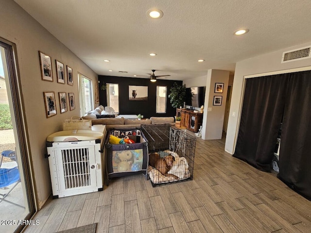 2514 W Big Oak St, Phoenix, AZ 85085 - living area with visible vents, wood finished floors, ceiling fan, recessed lighting, and a textured ceiling