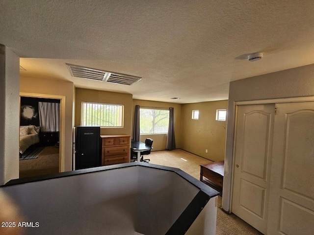 2514 W Big Oak St, Phoenix, AZ 85085 - kitchen featuring light colored carpet, a textured ceiling, and visible vents