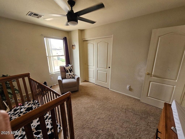2514 W Big Oak St, Phoenix, AZ 85085 - carpeted bedroom featuring visible vents, a closet, a textured wall, baseboards, and a nursery area