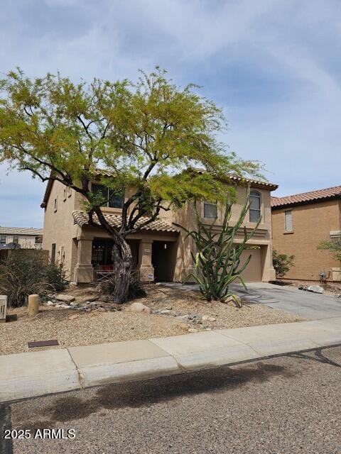 2514 W Big Oak St, Phoenix, AZ 85085 - view of front of property featuring a garage, stucco siding, a tile roof, and concrete driveway