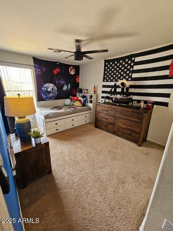 2514 W Big Oak St, Phoenix, AZ 85085 - carpeted bedroom featuring a textured ceiling, ceiling fan, and visible vents