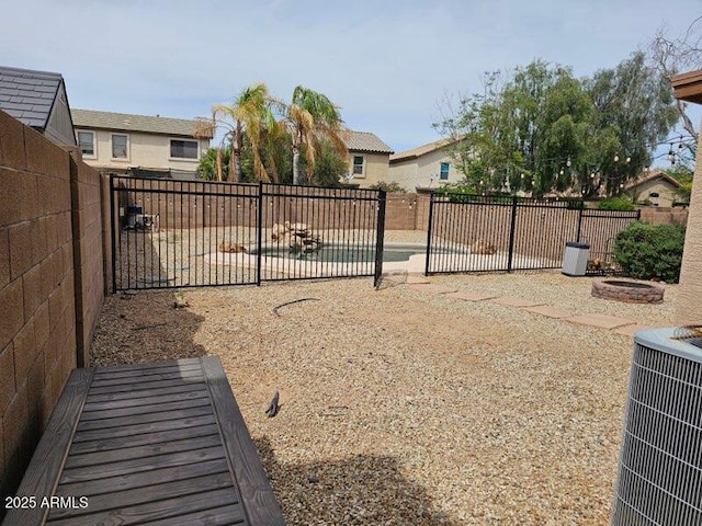 2514 W Big Oak St, Phoenix, AZ 85085 - view of gate with a fenced backyard, central AC unit, and a patio area