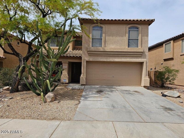2514 W Big Oak St, Phoenix, AZ 85085 - view of front of house featuring concrete driveway, a tiled roof, a garage, and stucco siding