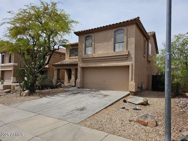 2514 W Big Oak St, Phoenix, AZ 85085 - mediterranean / spanish-style home with concrete driveway, stucco siding, a tile roof, and a garage