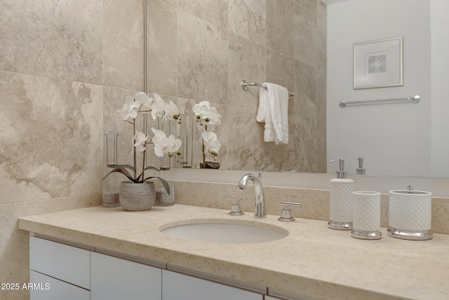 bathroom featuring tile walls and vanity