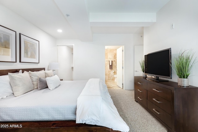 bedroom with light carpet, connected bathroom, and recessed lighting