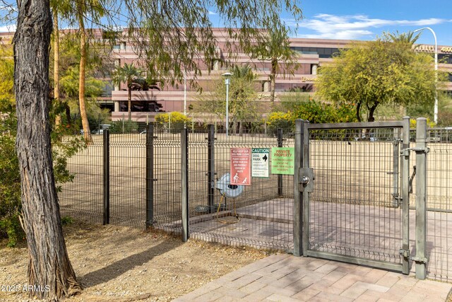 view of gate featuring fence