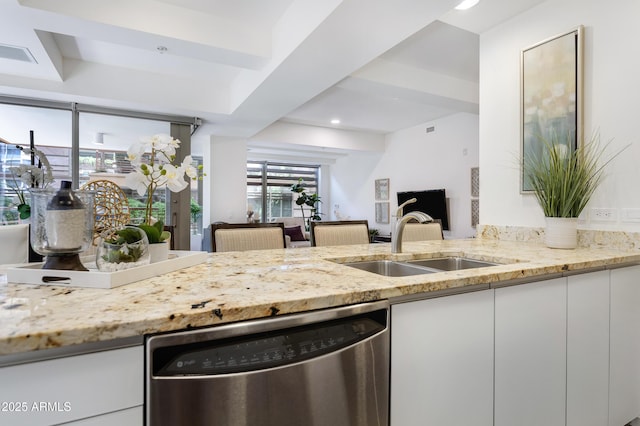 kitchen featuring light stone counters, a sink, visible vents, white cabinetry, and dishwasher