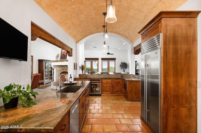 40039 N 107th Pl, Scottsdale, AZ 85262 - kitchen featuring stainless steel appliances, a sink, brown cabinetry, wine cooler, and ceiling fan