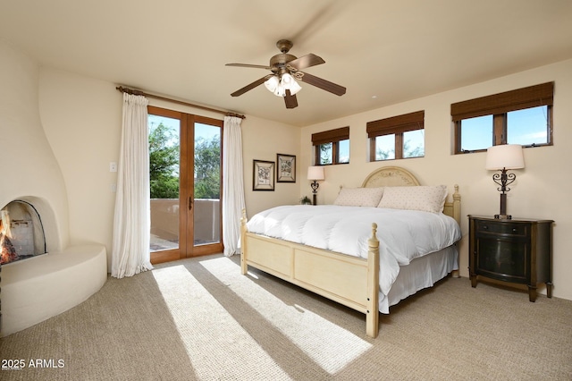 40039 N 107th Pl, Scottsdale, AZ 85262 - bedroom with access to exterior, light carpet, and ceiling fan