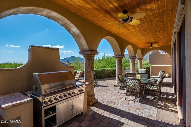 40039 N 107th Pl, Scottsdale, AZ 85262 - view of patio / terrace with ceiling fan, outdoor dining area, a mountain view, and area for grilling