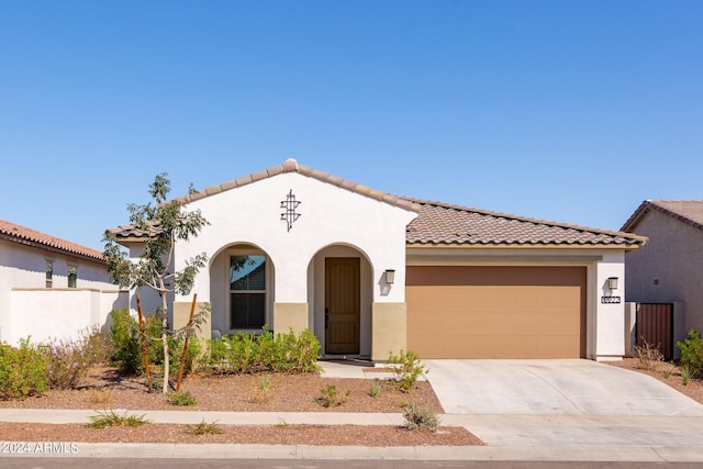 mediterranean / spanish-style house featuring a garage