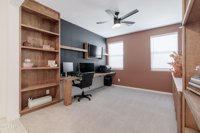 office area with ceiling fan and light carpet