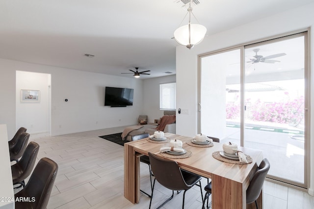 dining room featuring ceiling fan