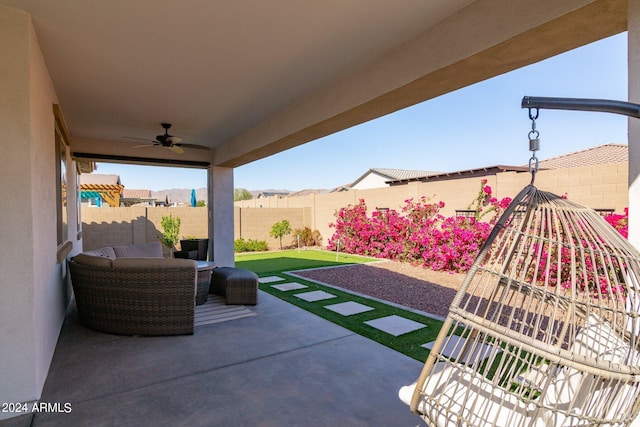 view of patio featuring ceiling fan