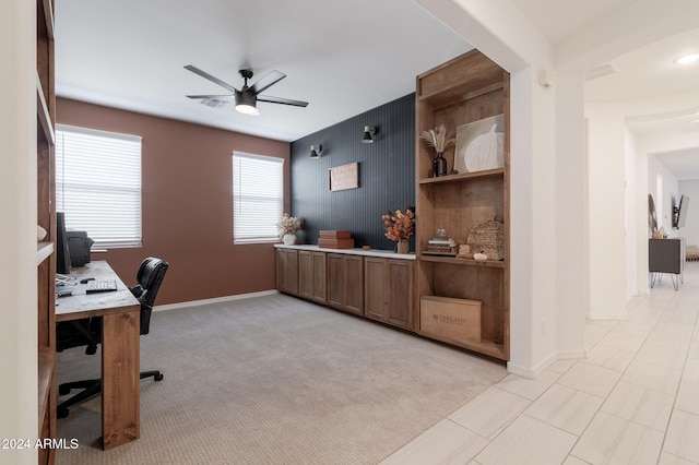 office with light carpet and ceiling fan