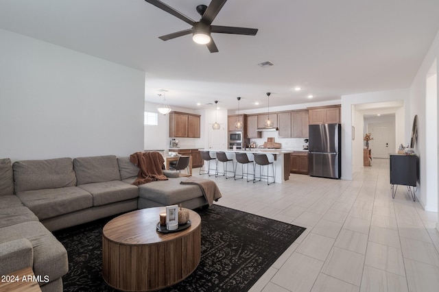 living room with ceiling fan