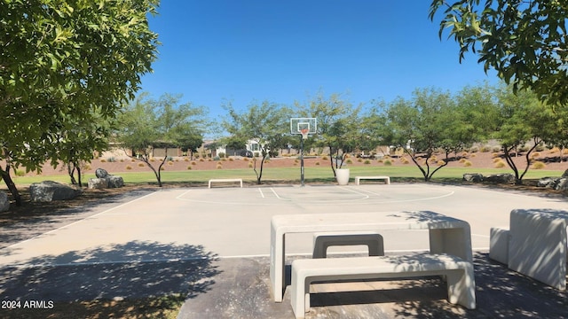 view of basketball court featuring a yard