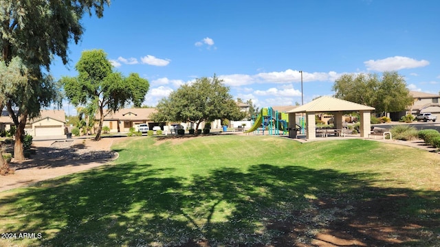 surrounding community featuring a gazebo, a lawn, and a playground