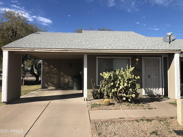 4042 E Carson Rd, Phoenix, AZ 85042 - garage with driveway and a carport