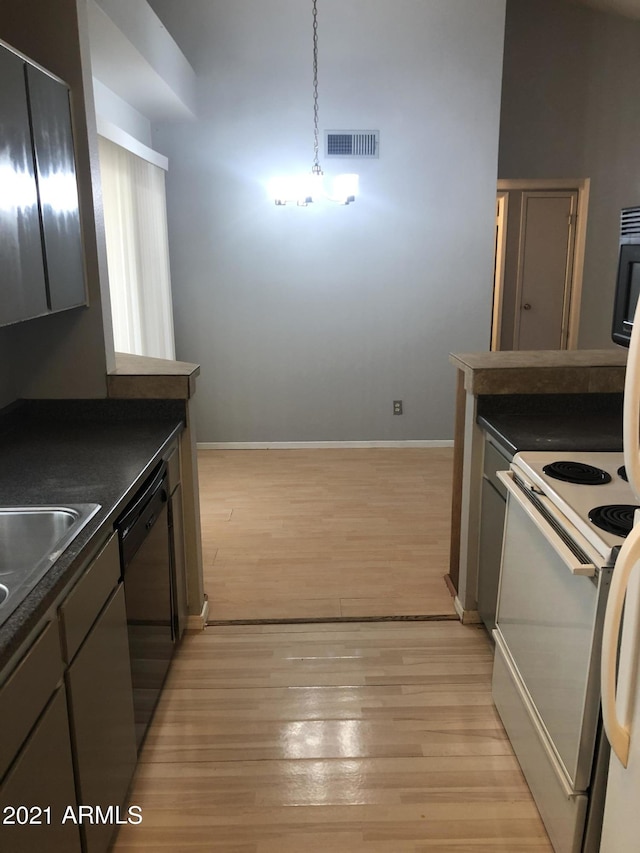 4042 E Carson Rd, Phoenix, AZ 85042 - kitchen featuring dishwasher, white range with electric stovetop, dark countertops, and light wood finished floors